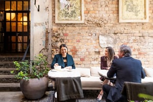 128121-delegates-smile-in-cafe-web-optimised-2560px-webp